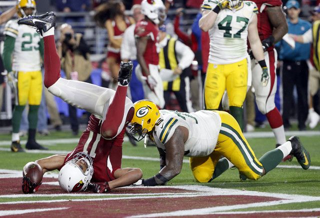 Jeff Janis holds up ball after Hail Mary catch, AP photo