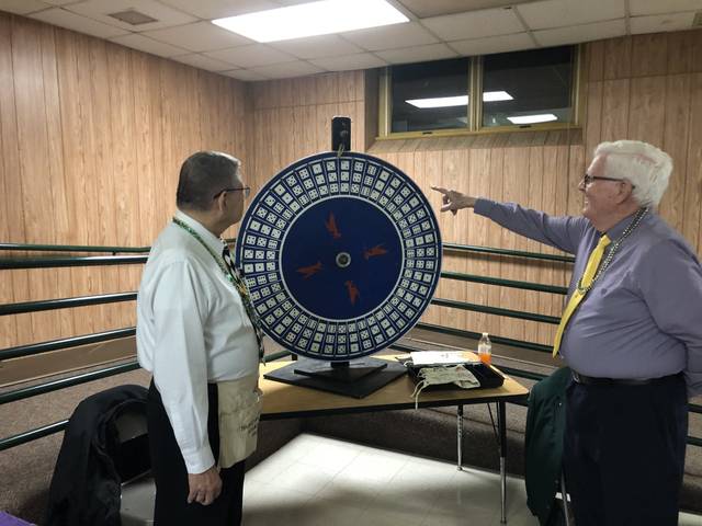 <p>Rich Schlude, left, and Ed Cavanaugh spin the ‘Big 6’ money wheel.</p> <p>Kevin Carroll | Times Leader</p>