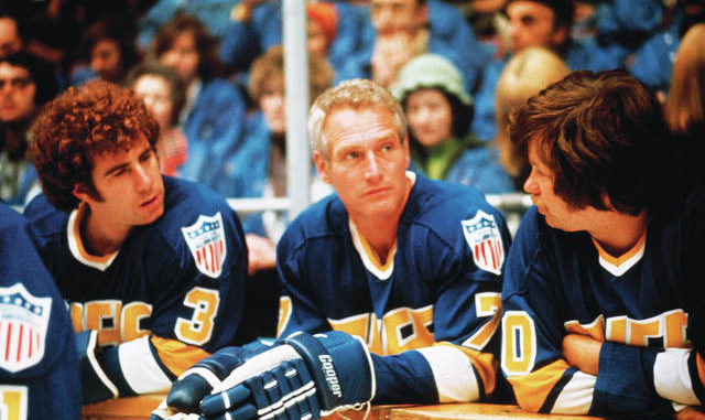  This undated photo provided Courtesy of Universal Pictures shows actors Jerry Houser, left, and Paul Newman, center, in a scene from the movie Slap Shot. Slap Shot was No. 5 in The Associated Press Top 25 favorite sports movies poll. AP photo 