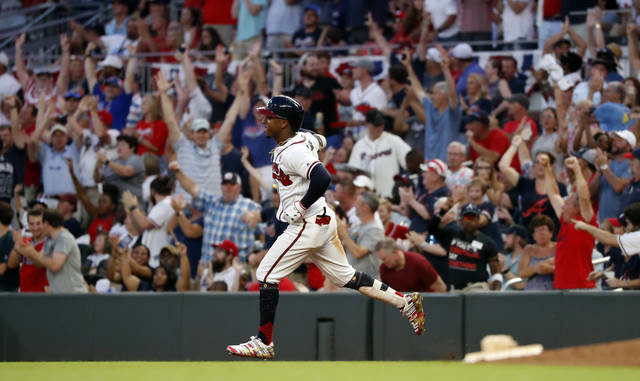  New stars like Ozzie Albies could be back on the field this summer, albeit without fans in the stand, based on a proposal from MLB owners that would be sent to the players union for consideration. John Bazemore | AP file photo 