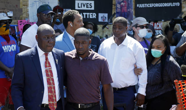  Family attorney Ben Crump, left, escorts Quincy Mason, second from left, a son of George Floyd, Wednesday, June 3, 2020, in Minneapolis, as they and some Floyd family members visited a memorial where Floyd was arrested on May 25 and died while in police custody. Video shared online by a bystander showed a white officer kneeling on his neck during his arrest as he pleaded that he couldnt breathe. Jim Mone | AP photo 