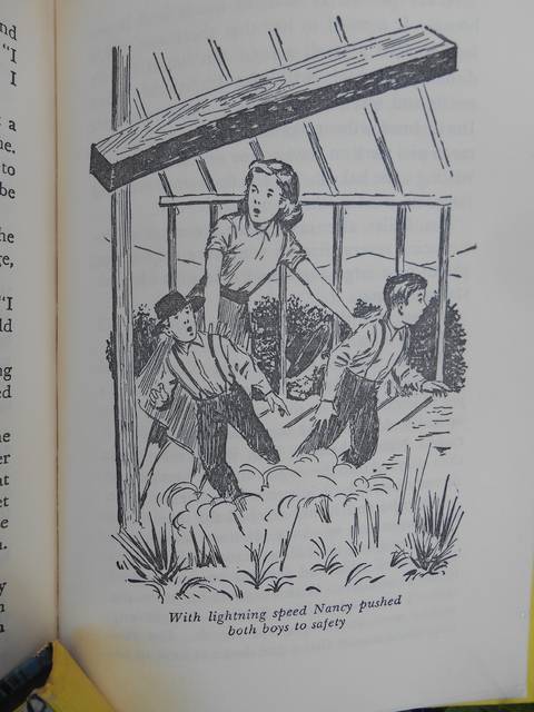 <p>It’s Nancy to the rescue as the quick-witted young woman pushes two children out of the way of a falling beam in ‘The Witch Tree Symbol.’</p>