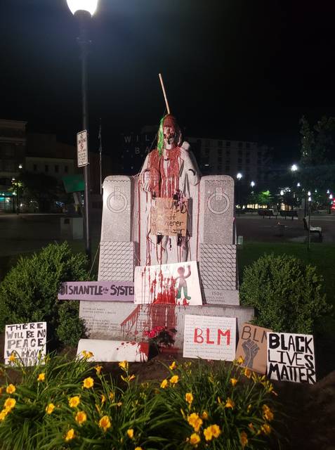 <p>The Christopher Columbus statue on Public Square on Wilkes-Barre is seen defaced Friday night following a demonstration on the square earlier in the evening.</p> <p>Joe Soprano | Times Leader</p>