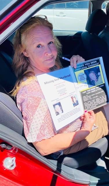
			
				                                Pauline Bailey, mother of Phylicia Thomas, holds a flyer she is posting everywhere she can in the hope that her daughter’s killer(s) will be found.
 
			
		