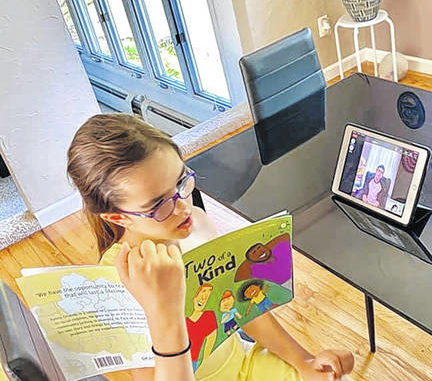  Sevana Kalaydjian reads to Kai Gomeau over Zoom as part of Gomeaus Read with a Teen community service program. Submitted photo 