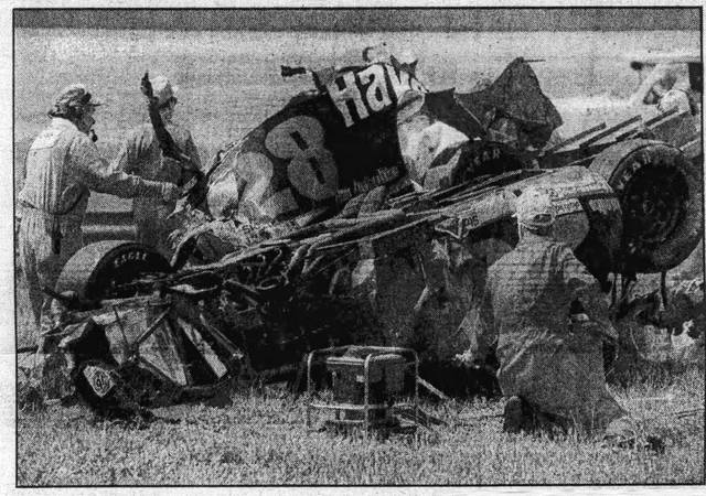 <p>Rescue workers come to the aid of Davey Allision have he barrel rolled 10 times though the grass infield in the second Pocono race in 1992.</p> <p>Times Leader file photo</p>