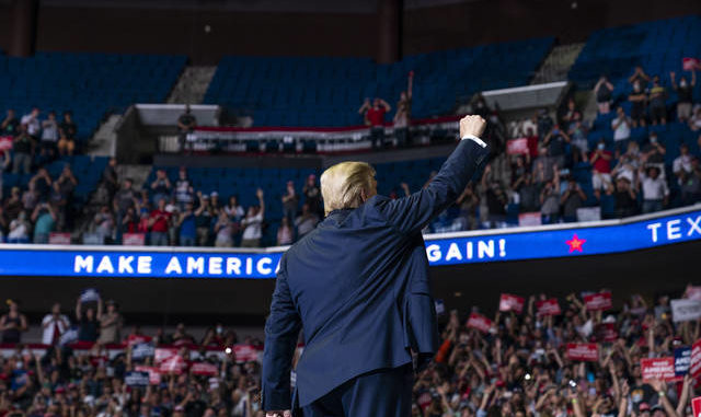  President Donald Trump arrives on stage to speak at a campaign rally at the BOK Center, Saturday, June 20, 2020, in Tulsa, Okla. (AP Photo/Evan Vucci) 