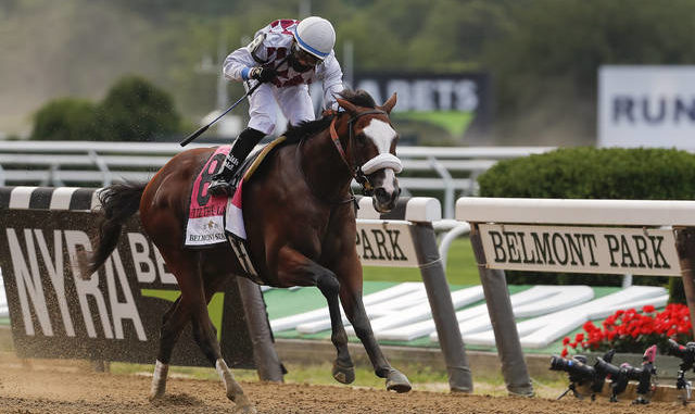  Tiz the Law (8), with jockey Manny Franco up, crosses the finish line to win the 152nd running of the Belmont Stakes on Saturday in Elmont, N.Y. AP photo 