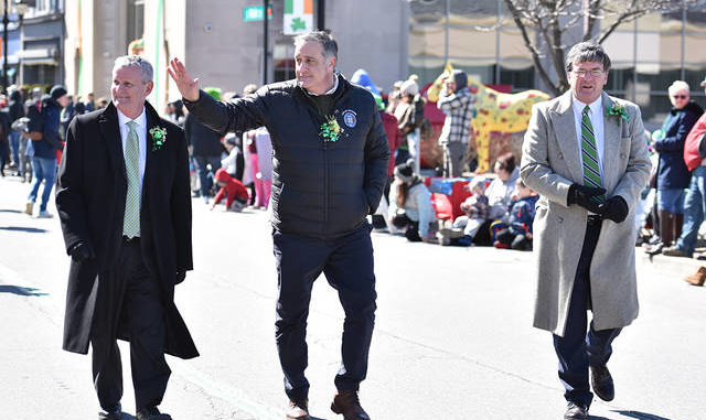  City of Pittston Mayor Michael Lombardo, center, waves to the thousands lining Main Street, Pittston, during the annual St. Patricks Day Parade in March  the only major St. Patricks Day parade held in Northeastern Pennsylvania before the COVID-19 pandemic brought much of the states business and community life fo a standstill. Lombardo is flanked by Thomas Leary, Luzerne County Community College, president, left, and state Rep. Michael Carroll, right. Times Leader file photo 