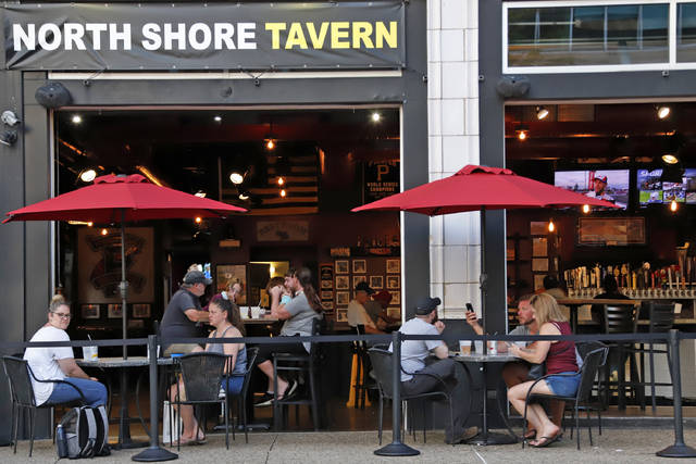 <p>People gather at the North Shore Tavern in Pittsburgh on Sunday.</p> <p>Gene J. Puskar | AP photo</p>
