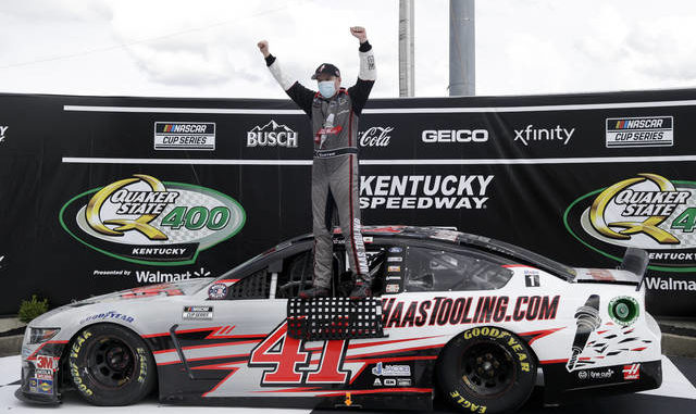  Cole Custer (41) celebrates after winning a NASCAR Cup Series race Sunday in Sparta, Ky. AP photo 