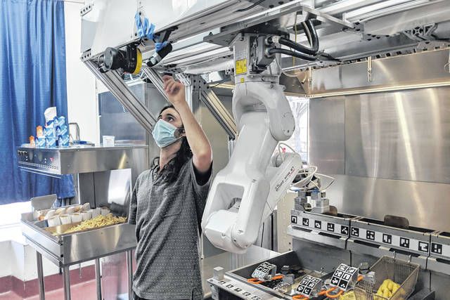 
			
				                                A technician makes an adjustment to a robot at Miso Robotics’ White Castle test kitchen in Pasadena, Calif. Robots that can flip burgers, make salads and even bake bread are in growing demand as virus-wary kitchens try to put some distance between workers and customers. Starting this fall, the White Castle burger chain will test the robot arm that can cook french fries and other foods. The robot, dubbed Flippy, is made by Pasadena, California-based Miso Robotics.
 
			
		