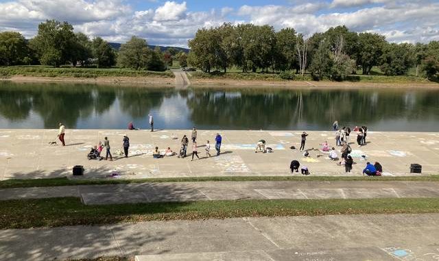  Families line the River Common to draw at Saturday’s ChalkFest, hosted by the Riverfront Parks Committee. Kevin Carroll | Times Leader 