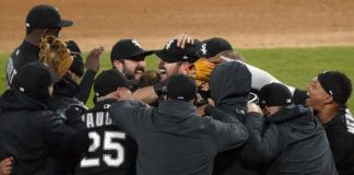 
			
				                                White Sox players mob pitcher Carlos Rodón, center, after he completed his no-hitter on Wednesday against Cleveland. Rodón allowed just one baserunner, losing a perfect game when he hit a batter in the foot with one out in the ninth inning.
                                 David Banks | AP photo

			
		
