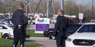 
			
				                                Police stand near the scene where multiple people were shot at the FedEx Ground facility early Friday morning, April 16, 2021, in Indianapolis. A gunman killed eight people and wounded several others before apparently taking his own life in a late-night attack at a FedEx facility near the Indianapolis airport, police said, in the latest in a spate of mass shootings in the United States after a relative lull during the pandemic. (AP Photo/Michael Conroy)
 
			
		