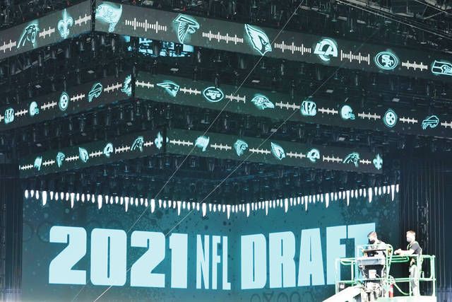 Why Trevor Lawrence, Justin Fields aren't at the 2021 NFL Draft in  Cleveland