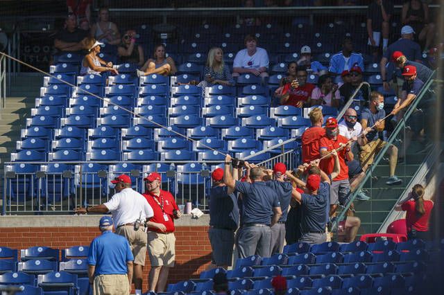 The Philadelphia Phillies ground crew pull a rope to fix the safety netting that snapped during the eighth inning of a game against the Washington Nationals on Sunday in Philadelphia.
                                 AP photo