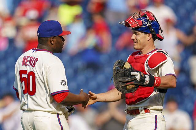 Phillies catcher Realmuto leaves after foul tip to mask