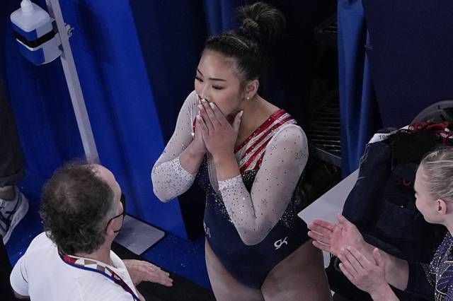 <p>Sunisa Lee, of the United States, reacts after getting her score on the floor performs on the during the artistic gymnastics women’s all-around final at the 2020 Summer Olympics, Thursday, July 29, 2021, in Tokyo. (AP Photo/Morry Gash)</p>