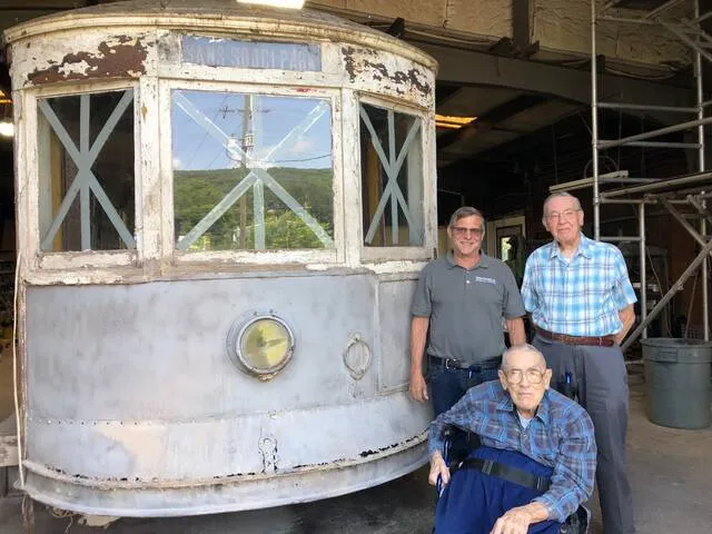 
			
				                                Wilkes University professor emeritus Harold E. Cox, center, visits Wilkes-Barre trolley car 790 in July 2019 at Baut Studios in Swoyersville, where the vintage streetcar is being restored. Cox is seen with Anthracite Trolleys Inc. members Conrad Baut, left, and Jim Wert.
                                 Roger DuPuis | Times Leader

			
		