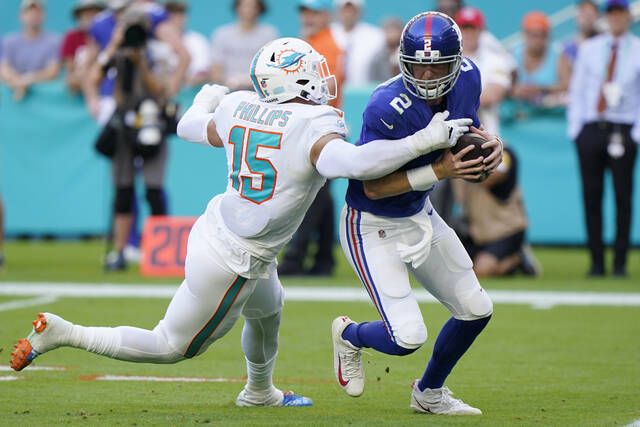 <p>Miami Dolphins outside linebacker Jaelan Phillips (15) sacks New York Giants quarterback Mike Glennon during the second half of an NFL game Sunday in Miami Gardens, Fla.</p>
                                 <p>AP photo</p>