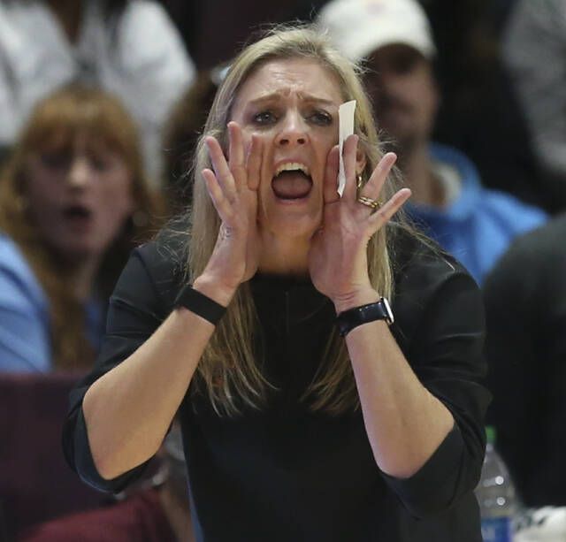 <p>Tennessee head coach Kellie Harper shouts in the second half of an NCAA college basketball game against Virginia Tech in Blacksburg, Va., Sunday, Dec. 5, 2021. (Matt Gentry/The Roanoke Times via AP)</p>