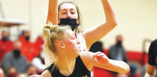 
			
				                                Lake Lehman’s Chase Purdy (33) makes a pass after pulling down a rebound as Holy Redeemer’s Angelina Corridoni defends during the second quarter on Thursday.
                                 Fred Adams | For Times Leader

			
		