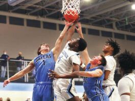 
			
				                                Dallas’ Austin Finarelli (1) and Wilkes-Barre Area’s Waarithi Oseni (4) fight for a rebound during Saturday night’s game.
                                 Fred Adams | For Times Leader

			
		