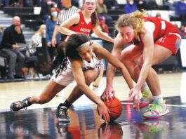 
			
				                                Wilkes-Barre Area’s Danayjha Moore (left) and Hazleton Area’s Brianna Kennedy fight for control of the ball during Thursday night’s game.
                                 Fred Adams | For Times Leader

			
		