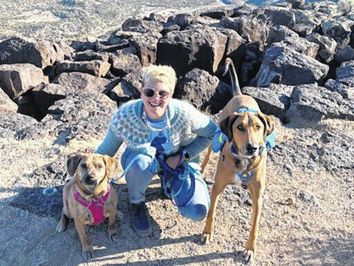 <p>This photo depicts Leksa Pravdic on a hike in Santa Fe, New Mexico with her dogs Scout, left, and Pluto during a road trip.</p>
                                 <p>Meredith Bennett-Swanson via AP</p>