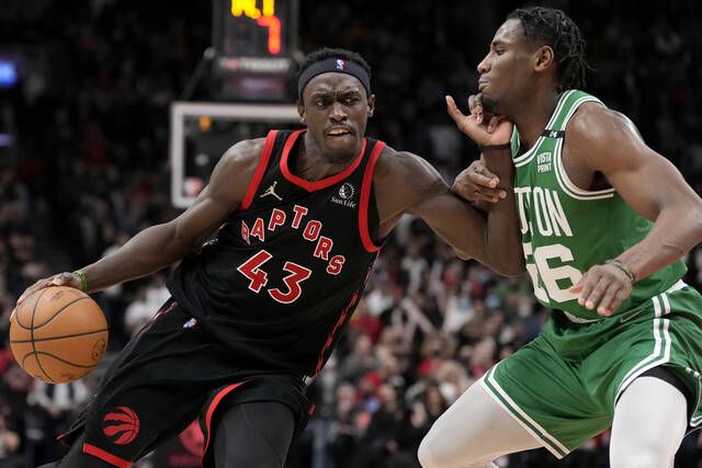 <p>Toronto Raptors forward Pascal Siakam (43) drives past Boston Celtics forward Aaron Nesmith (26) during second-half NBA game action in Toronto on Monday.</p>
                                 <p>AP photo</p>