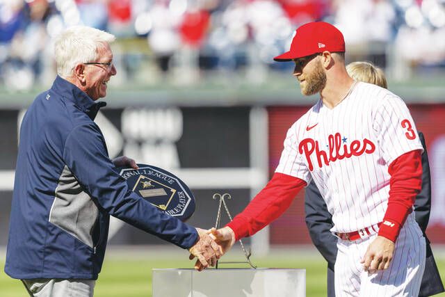 
			
				                                Philadelphia Phillies right fielder Bryce Harper receives the MVP plaque from former Phillie Mike Schmidt before the start a baseball game against the Oakland Athletics on Saturday in Philadelphia.
                                 AP photo

			
		