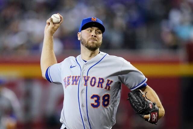 
			
				                                New York Mets starting pitcher Tylor Megill throws a pitch against the Arizona Diamondbacks during the first inning of a game Sunday in Phoenix.
                                 AP photo

			
		