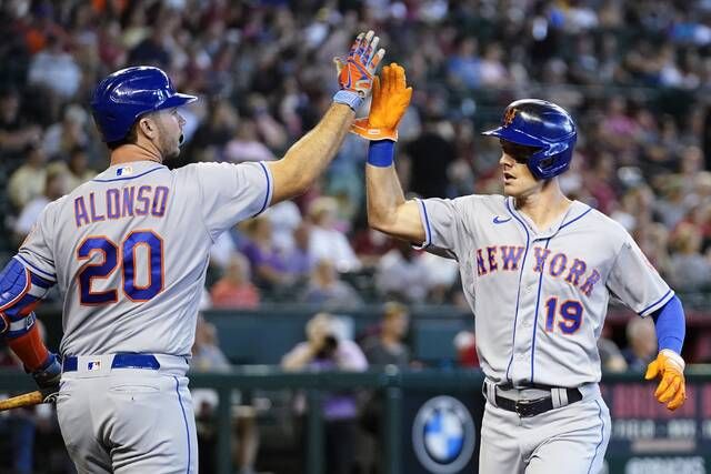<p>New York Mets’ Mark Canha (19) celebrates his run scored against the Arizona Diamondbacks with teammate Pete Alonso (20) during the first inning of a baseball game Sunday, April 24, 2022, in Phoenix. (AP Photo/Ross D. Franklin)</p>