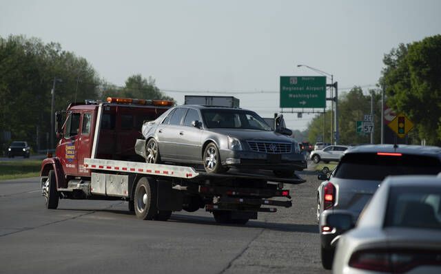 <p>Hamrick’s Towing & Recovery hauls the Cadillac sedan that fugitives Casey White and Vicky White, no relation, were driving when law enforcement officials forced them into a ditch at Burch Drive in Evansville, Ind., after a short chase Monday.</p>
                                 <p>AP photo</p>