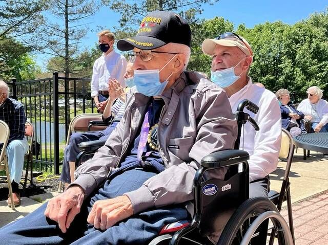 World War Two Veteran In Wheelchair Outdoors Wearing Cap Stock