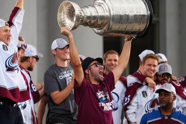 <p>Colorado Avalanche center Nazem Kadri hoists the Stanley Cup at a rally for the NHL hockey champions Thursday, June 30, 2022, in Denver. (AP Photo/Jack Dempsey)</p>