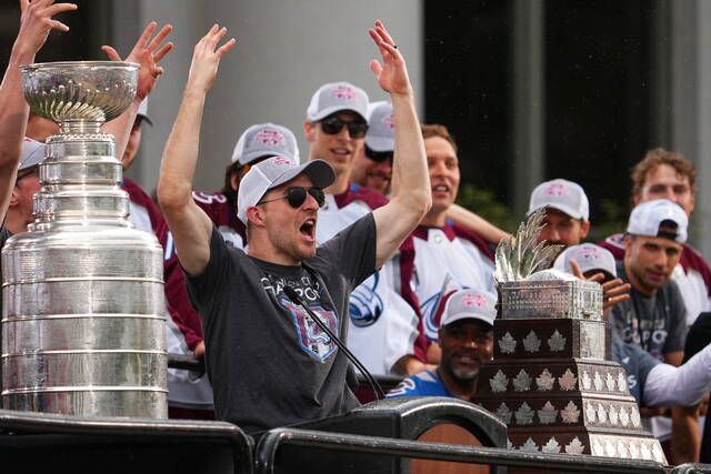 <p>Colorado Avalanche defenseman Devon Toews cheers during a rally for the Stanley Cup NHL hockey champions Thursday, June 30, 2022, in Denver. (AP Photo/Jack Dempsey)</p>