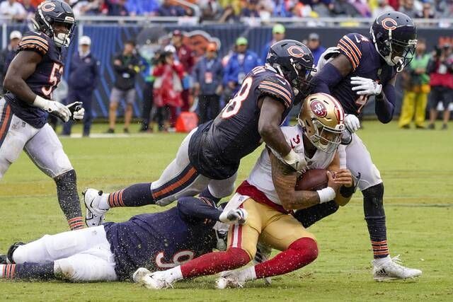 Chicago Bears place kicker Cairo Santos (8) kick a field goal off the hold  of Trenton Gill during the first half of an NFL football game against the  Green Bay Packers Sunday