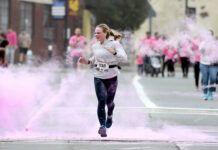 
			
				                                Marnie Kusakavitch passes through pink chalk yards away from the finish line at Paint Pittston Pink’s 5K race. Her time was 20:57.
                                 Tony Callaio | For Times Leader

			
		