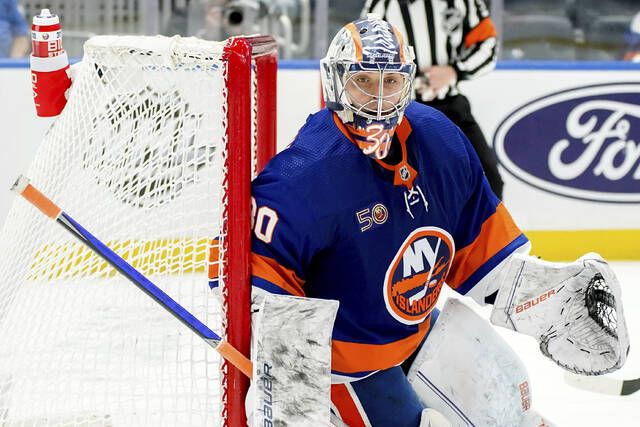 Dobson scores in OT to rally Islanders past Flames, 4-3