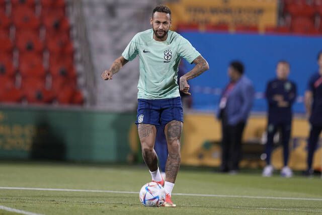 Brazils Neymar practices during a training session at the Grand Hamad stadium in Doha, Qatar, on Sunday. Brazil will face South Korea in a World Cup round of 16 match on Dec. 5.
                                 AP photo