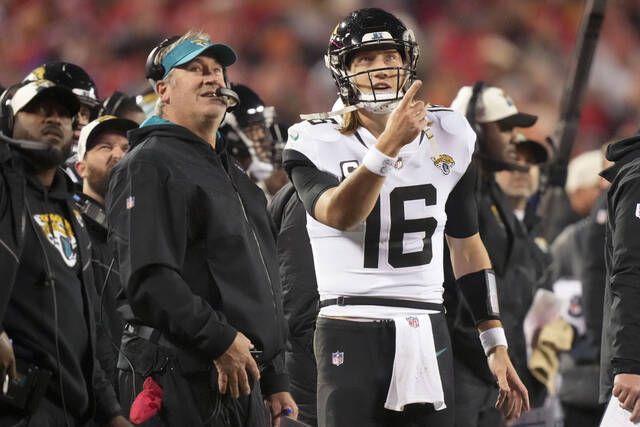 Jacksonville Jaguars quarterback Trevor Lawrence (16) prepares to