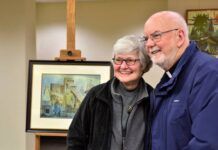 
			
				                                Local artist Sue Hand joins former King’s College President The Rev. Thomas O’Hara near her painting of the Dorrance breaker Thursday night. The painting was purchased and donated to King’s and unveiled Thursday during an Anthracite Heritage Month event.
                                 Mark Guydish | Times Leader

			
		