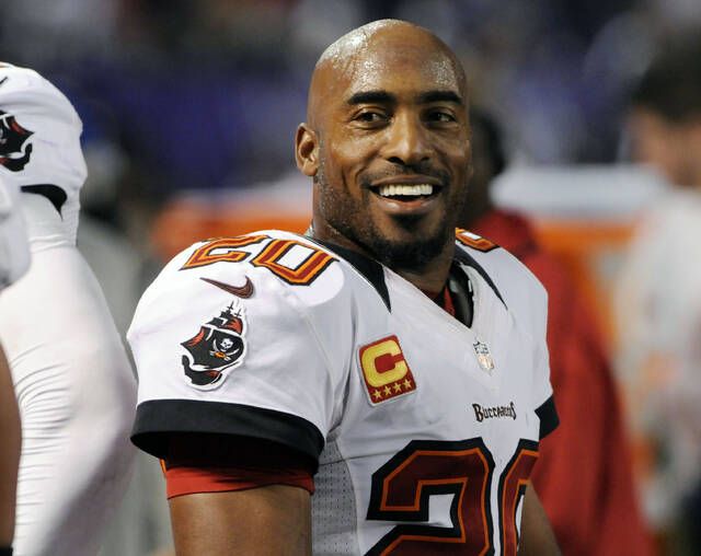 Brother, Tiki Barber, presents former Tampa Bay Buccaneers cornerback Rondé  Barber