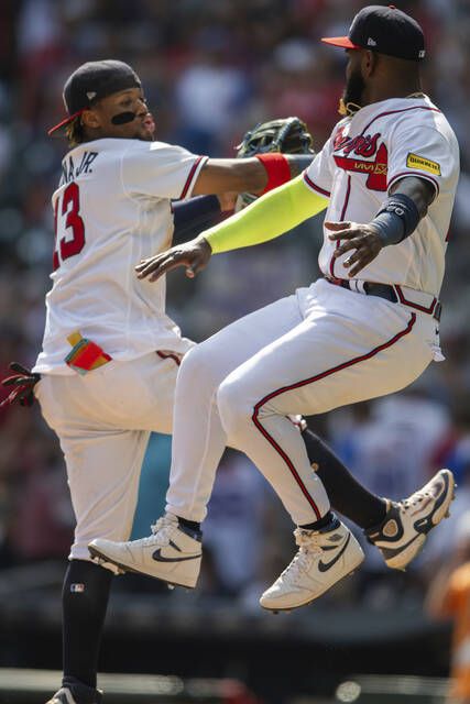 Braves become 1st MLB team to clinch playoff spot as Acuña and Olson lead  rally past Pirates 