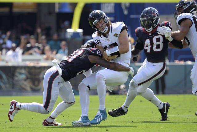 Beck's rare TD return propels Texans to a 37-17 rout of Jaguars and gives  Ryans his first win