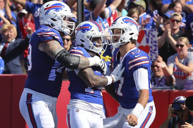 Josh Allen throws 4 TD passes, runs for score, Bills rout division