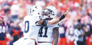 
			
				                                Kobe King (41) celebrates recovering a fumble forced by Dominic DeLuca (0) earlier this season. King is one of three Penn State defensive starters heading home to Detroit for Friday’s game against Michigan State.
                                 Charles Rex Arbogast | AP file photo

			
		