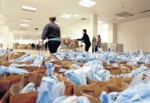 
			
				                                Thousands of bags of food wait to be distributed during a CEO Thanksgiving food giveaway in this file photo.
                                 Times Leader file photo 

			
		